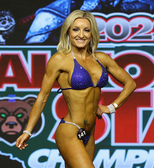 lady posing in body building championship